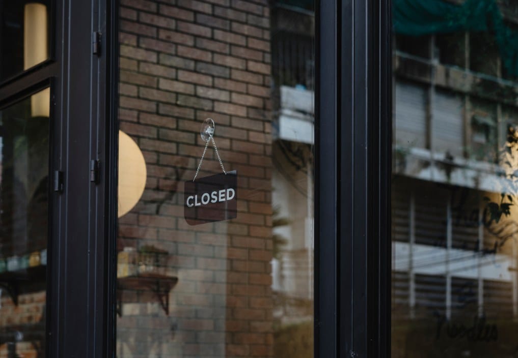 storefront with a closed sign