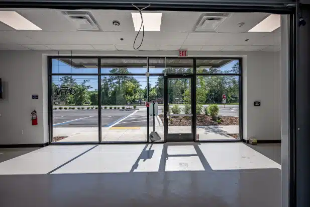 empty retail store concrete floors large window